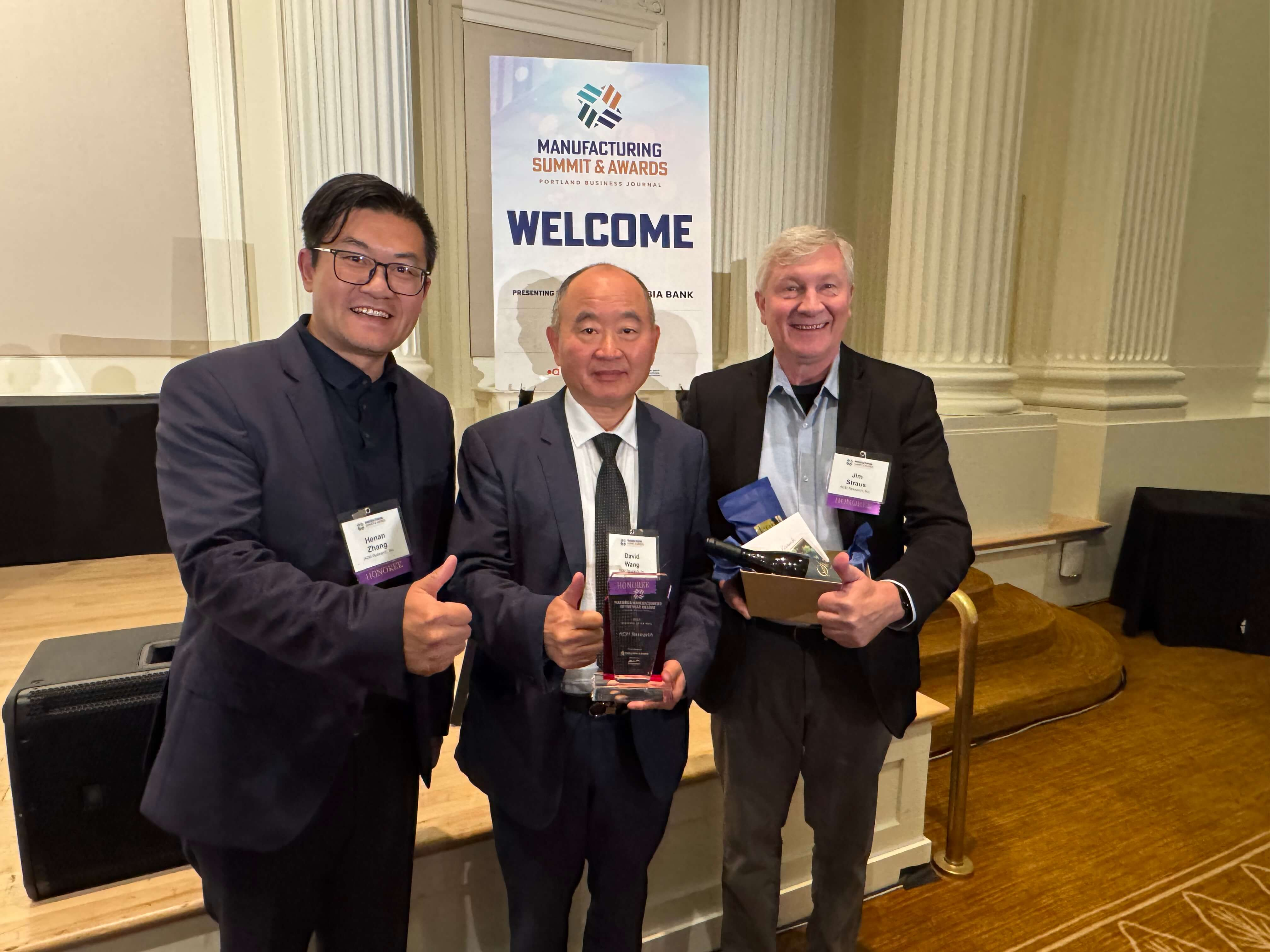 CEO and President Dr. David Wang, VP of Sales Jim Straus, and General Manager Henan Zhang with Innovator of the Year Award